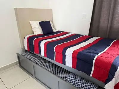 Cama o camas de una habitación en Alojamiento Cerca de la Playa en Cerritos