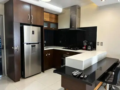 Una cocina o zona de cocina en Depa Frente al Parque Central, Excelente Ubicacion