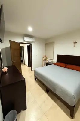 Cama o camas de una habitación en Departamento frente al mar en Playa Brujas