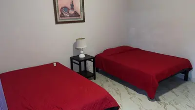 Cama o camas de una habitación en Hospedajes Evelin