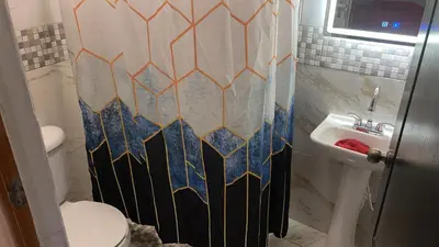 Un baño de Hospedajes Evelin