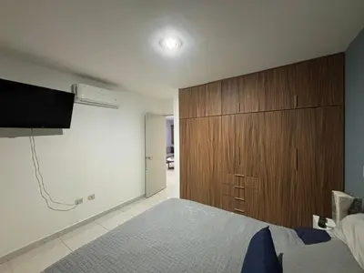 Cama o camas de una habitación en Departamento en privada en Mazatlan, con alberca