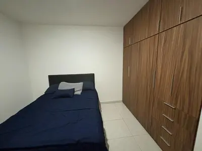 Cama o camas de una habitación en Departamento en privada en Mazatlan, con alberca