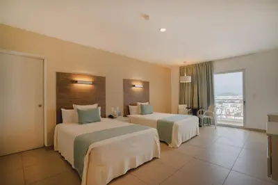 Cama o camas de una habitación en Pacific Palace Beach Tower Hotel
