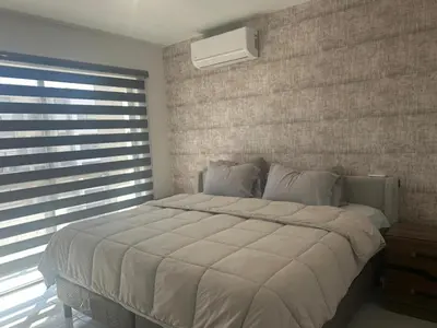 Cama o camas de una habitación en Depa Palmeras Adora Mazatlán