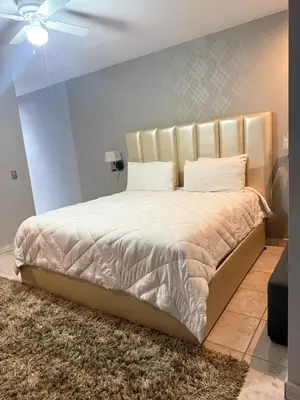 Cama o camas de una habitación en Nueva Vizcaya & Suites