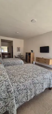 Cama o camas de una habitación en Suites EL FARO San Carlos
