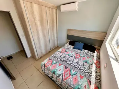 Cama o camas de una habitación en Almar Departamento con alberca cerca de la playa