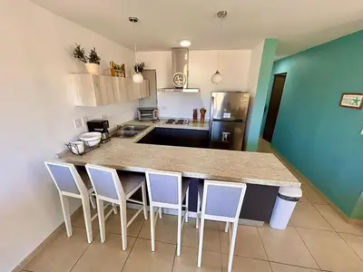 Una cocina o zona de cocina en Almar Departamento con alberca cerca de la playa