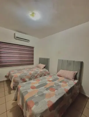 Cama o camas de una habitación en departamento