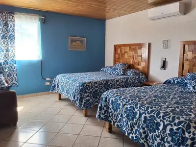 Cama o camas de una habitación en Villas La quinta by Black Birds
