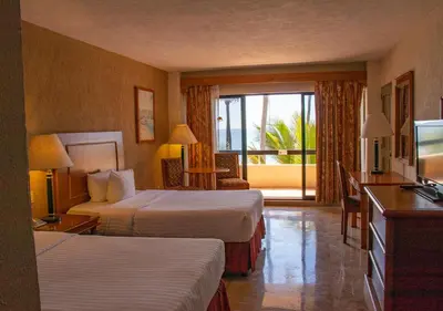 Cama o camas de una habitación en The Palms Resort of Mazatlan