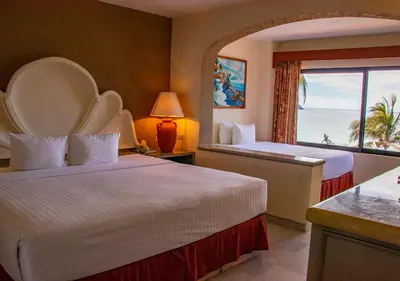 Cama o camas de una habitación en The Palms Resort of Mazatlan