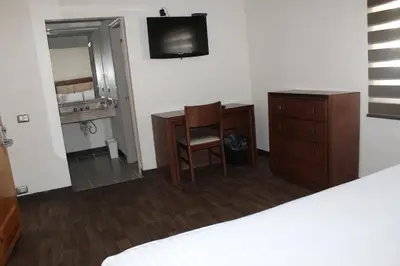 Cama o camas de una habitación en Hotel Adriana