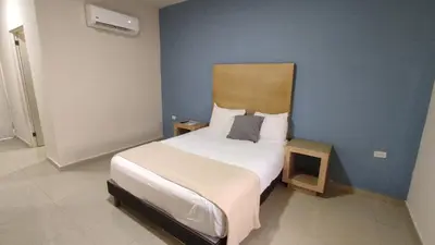Cama o camas de una habitación en Capital Hotel