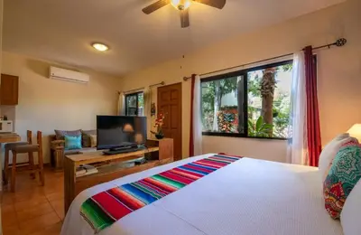 Cama o camas de una habitación en Hotel Casa Mangos Loreto