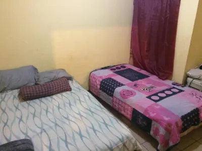 Cama o camas de una habitación en Blanquita guesthouse