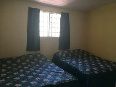 Cama o camas de una habitación en Blanquita guesthouse
