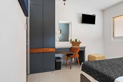 Cama o camas de una habitación en Homesuites Zaragoza