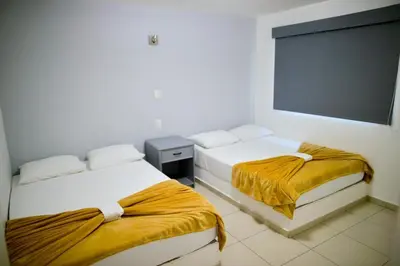Cama o camas de una habitación en Mona Inn