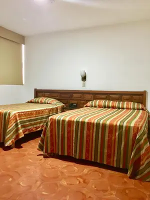 Cama o camas de una habitación en Hotel del Valle