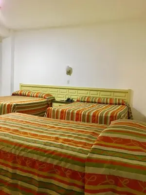 Cama o camas de una habitación en Hotel del Valle