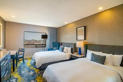 Cama o camas de una habitación en Hotel Lucerna Hermosillo