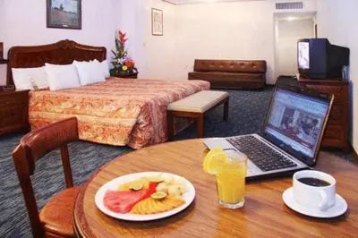 Una televisión o centro de entretenimiento en Hotel San Jorge
