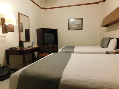 Cama o camas de una habitación en Hotel Premier Saltillo Coahuila