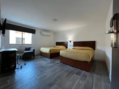 Cama o camas de una habitación en Neo Business Hotel