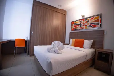 Cama o camas de una habitación en Hotel Villa Express Durango