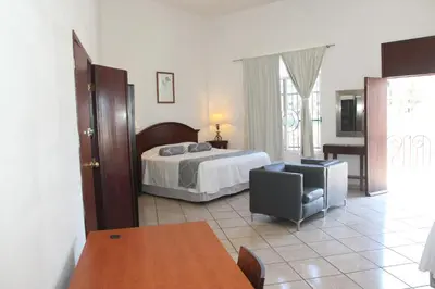 Cama o camas de una habitación en Hotel Posada Doña Rubino