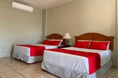 Cama o camas de una habitación en Hotel Posada Doña Rubino