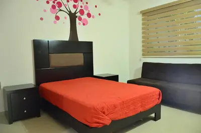 Cama o camas de una habitación en Departamentos Luminar