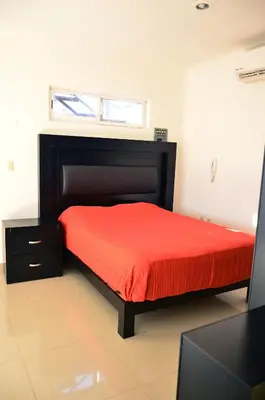 Cama o camas de una habitación en Departamentos Luminar