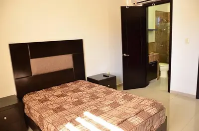 Cama o camas de una habitación en Departamentos Luminar