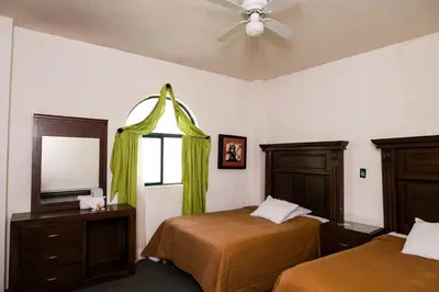 Cama o camas de una habitación en Hotel María Elena