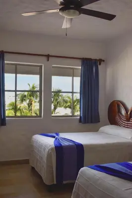 Cama o camas de una habitación en Hotel Quijote Inn
