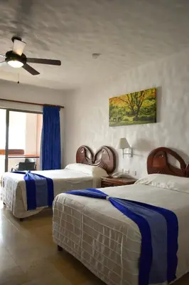 Cama o camas de una habitación en Hotel Quijote Inn
