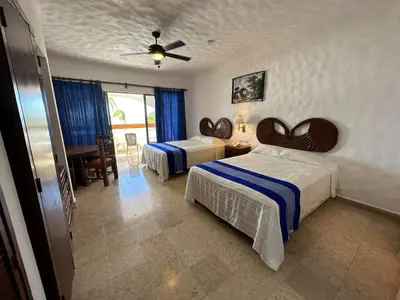 Cama o camas de una habitación en Hotel Quijote Inn