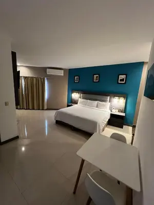 Cama o camas de una habitación en Hotel El Rancho