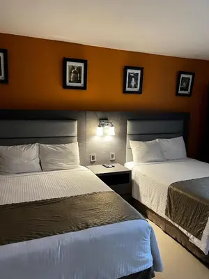 Cama o camas de una habitación en Hotel El Rancho
