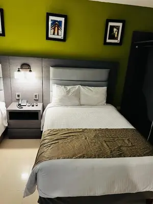 Cama o camas de una habitación en Hotel El Rancho