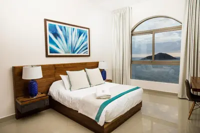 Cama o camas de una habitación en Petit Luxe Las Gavias Penthouse