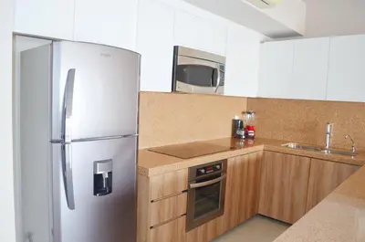 Una cocina o zona de cocina en Bahia Marina Departamentos