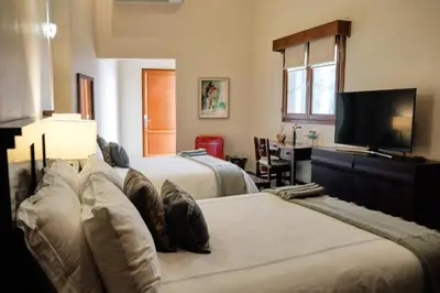 Cama o camas de una habitación en Casa Lucila Mazatlán Curamoria Collection