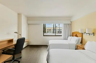 Cama o camas de una habitación en Fiesta Inn Express Chihuahua