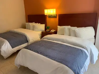 Cama o camas de una habitación en Casagrande Hotel