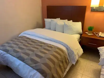 Cama o camas de una habitación en Casagrande Hotel