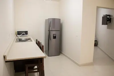 Una cocina o zona de cocina en Hotel Nápoles